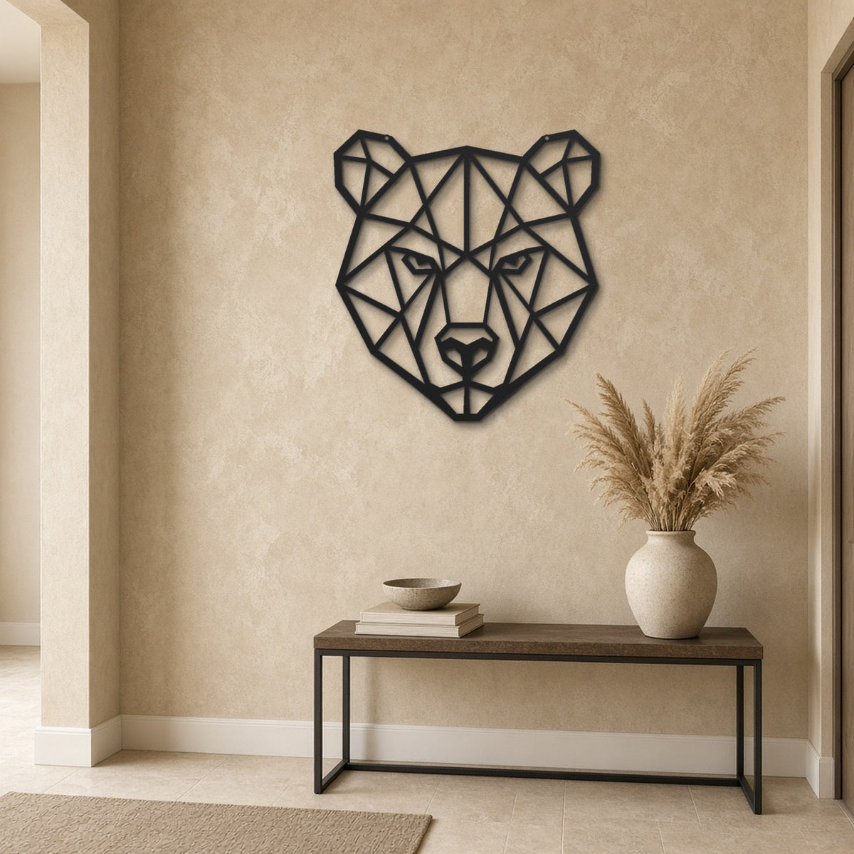 Geometric Bear Head black metal wall art hanging on a hallway wall