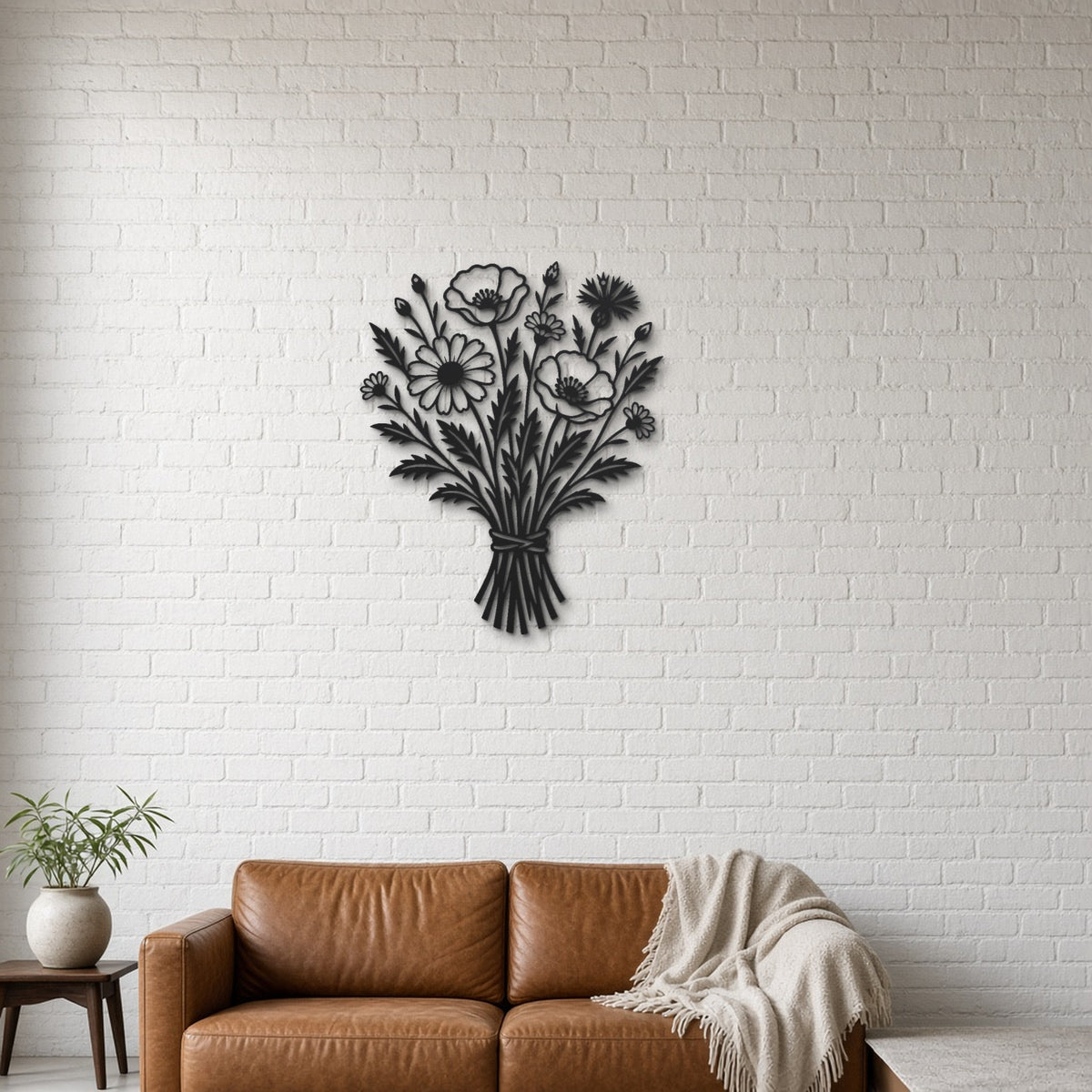 Wildflower Bouquet black metal wall art hanging on a lounge with white brick wall wall