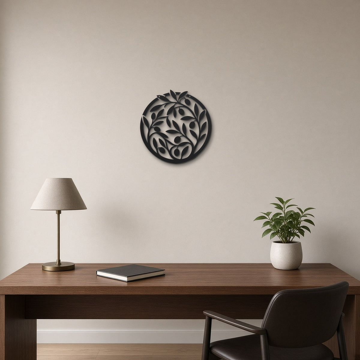 Olive Branch Wreath black metal wall art hanging on a home office wall