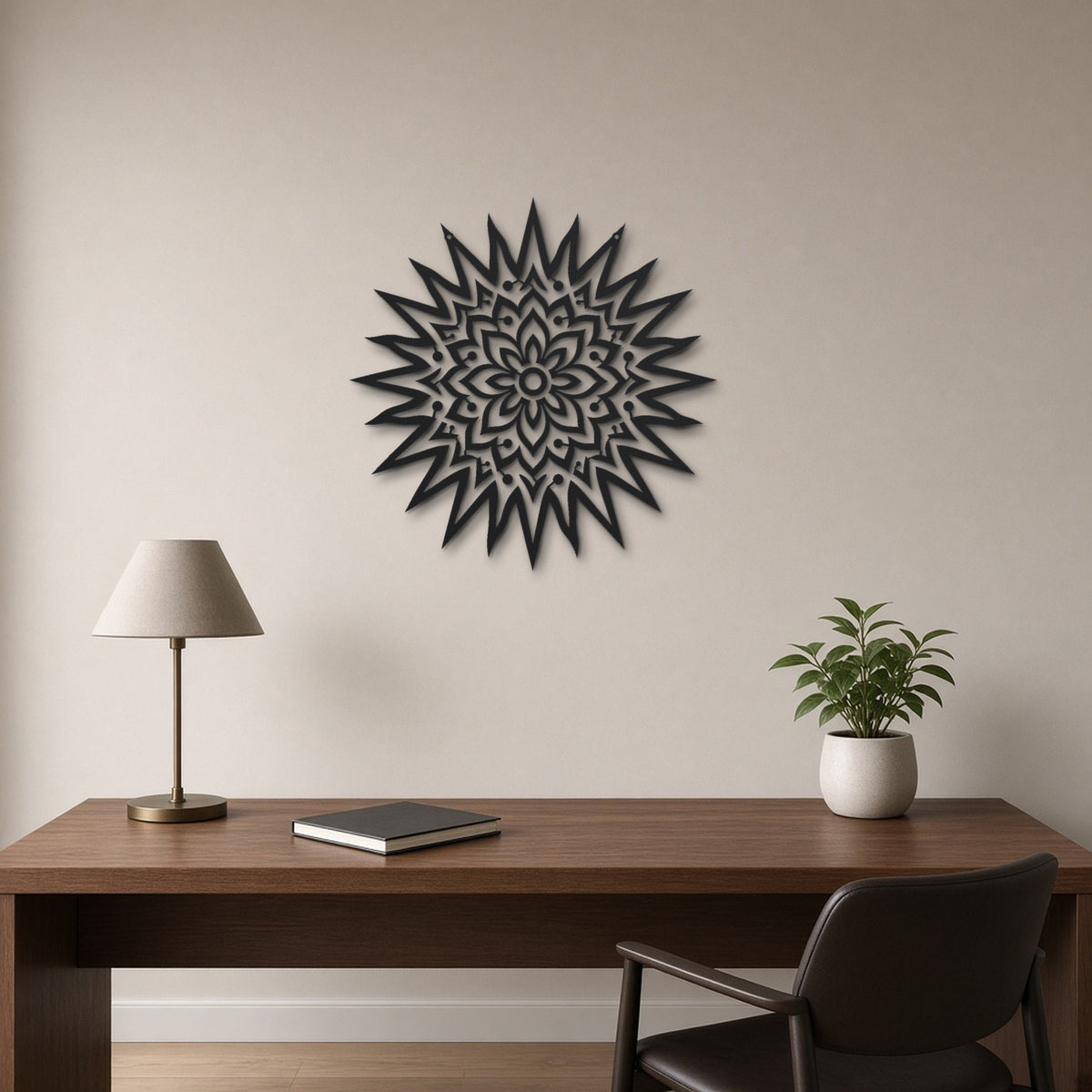 Sun Mandala black metal wall art hanging on a home office wall