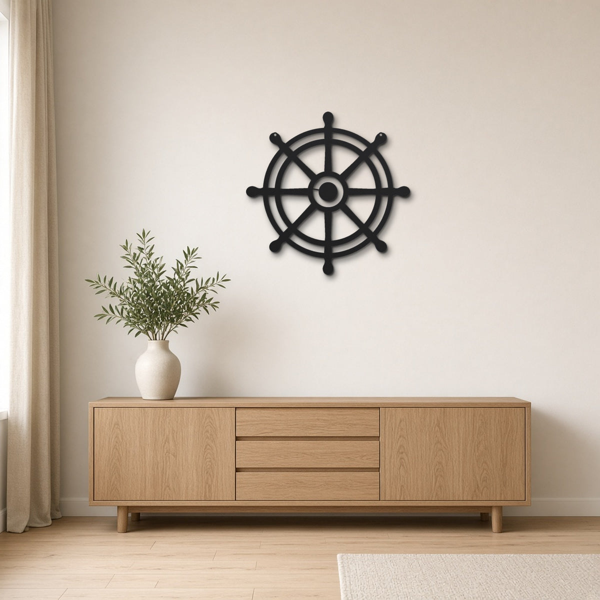 Ship's Wheel black metal wall art hanging on a Scandinavian living room wall