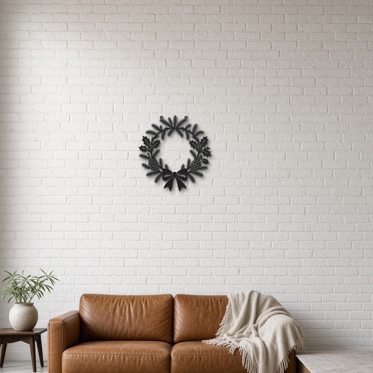 Christmas Wreath black metal wall art hanging on a lounge with white brick wall wall