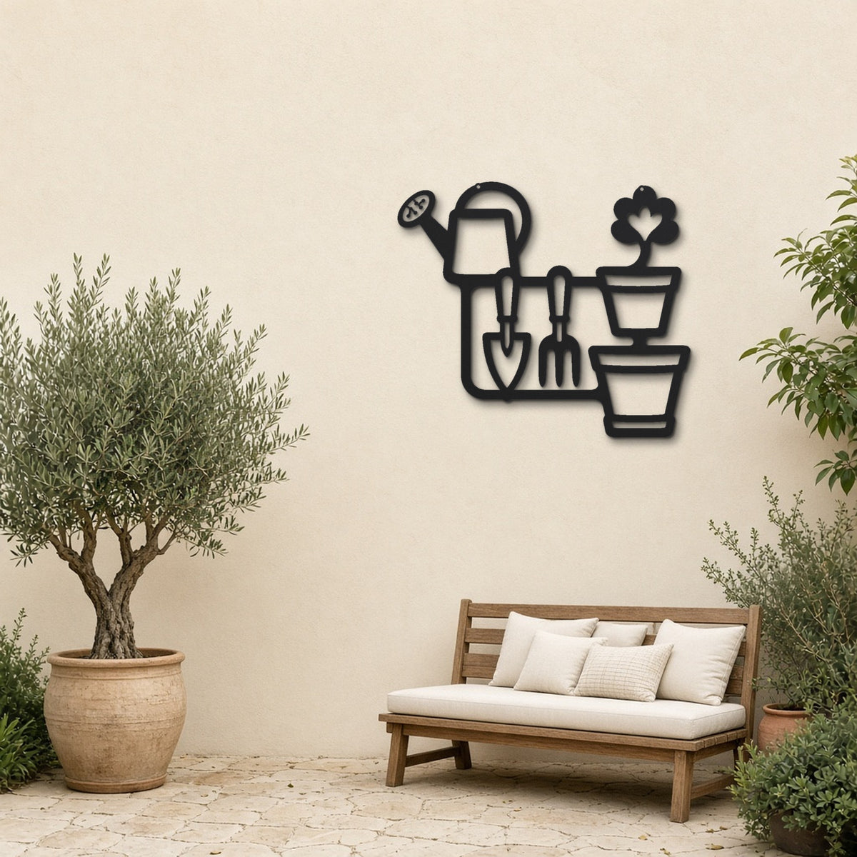 Garden Tools black metal wall art hanging on a garden patio wall