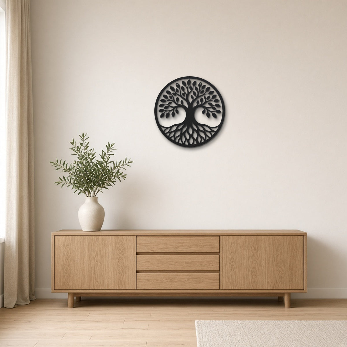 Tree of Seasons black metal wall art hanging on a Scandinavian living room wall