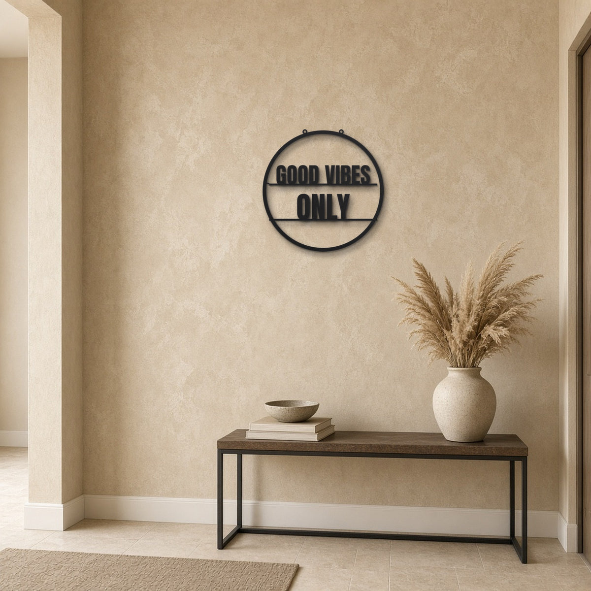Good Vibes Only black metal wall art hanging on a hallway wall