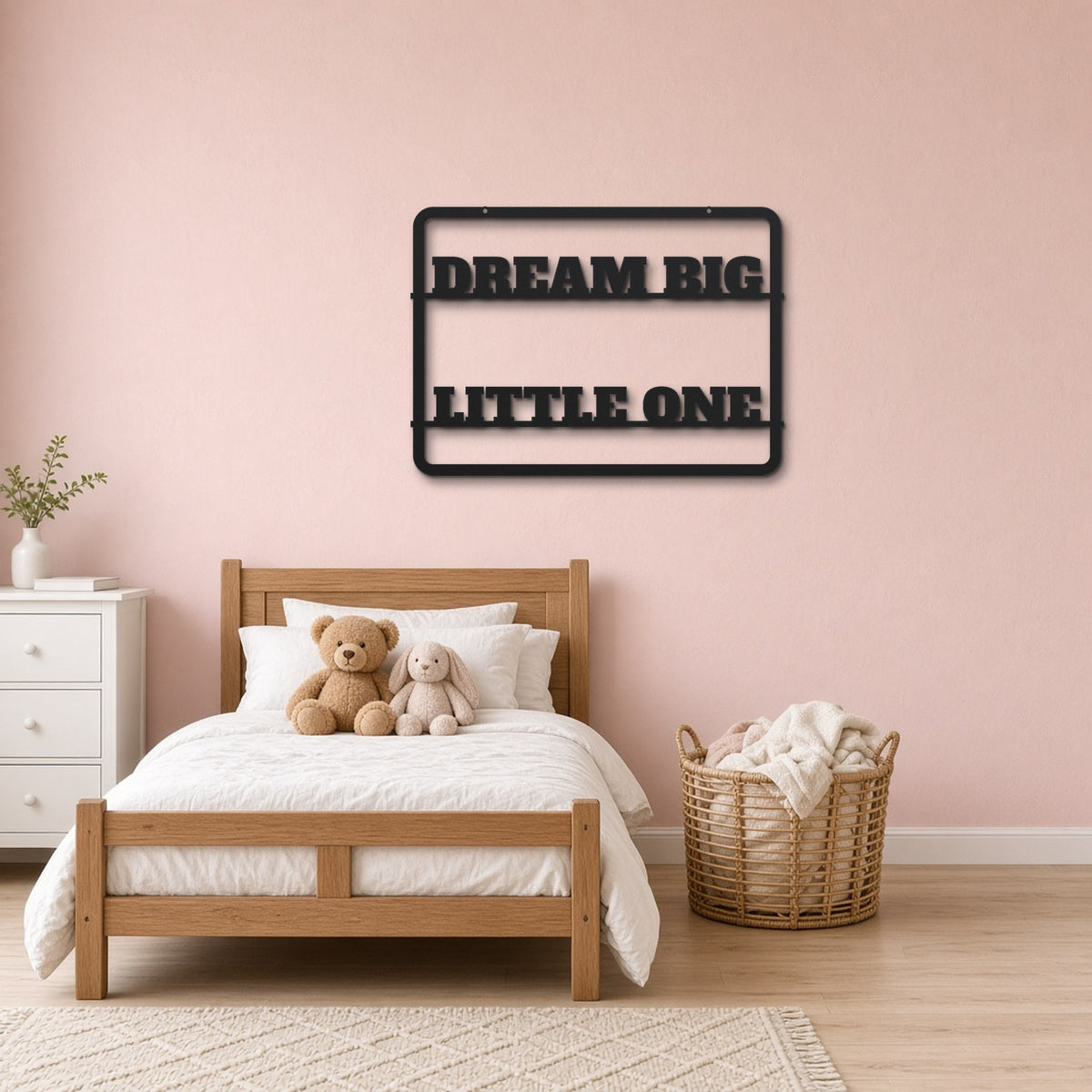 Dream Big Little One black metal wall art hanging on a children's bedroom wall
