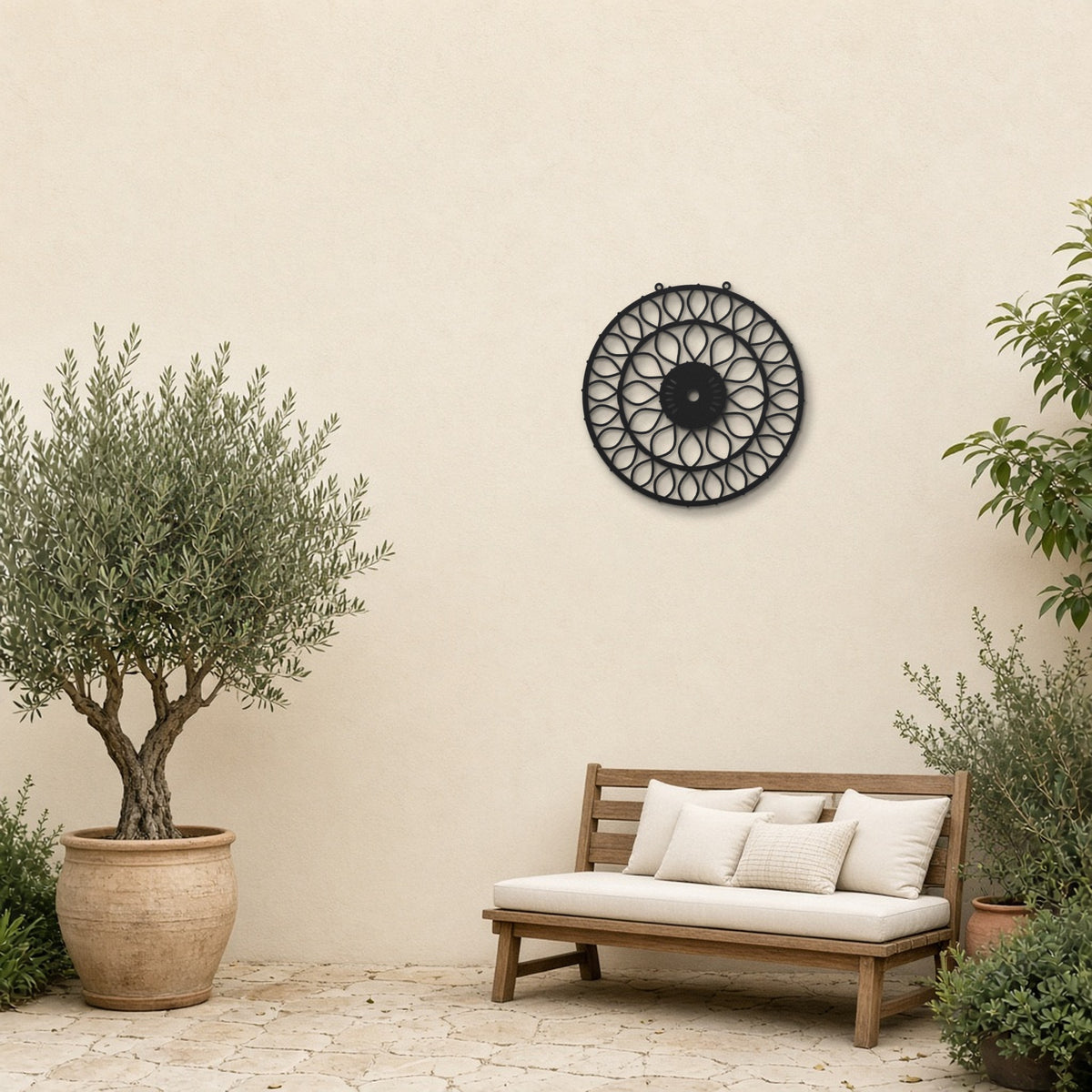 Geometric Mandala Petal Bloom black metal wall art hanging on a garden patio wall