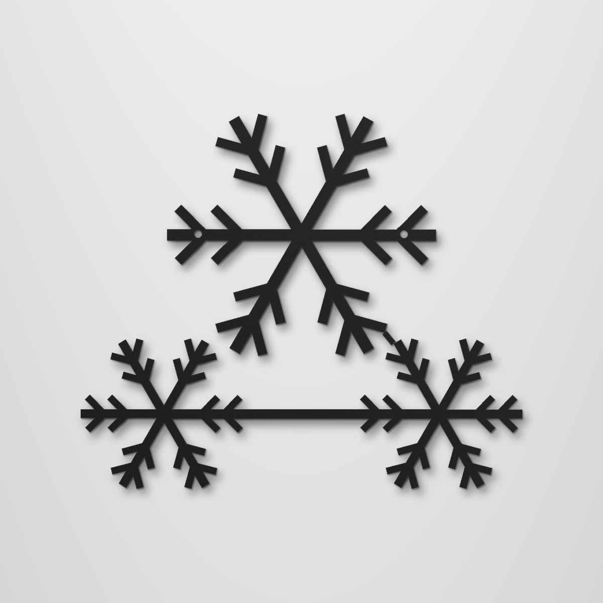 Snowflake Trio laser cut steel wall art in matte black, front view